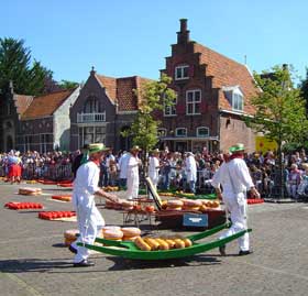 Carrying the cheese to be weighed on the traditional sleigh