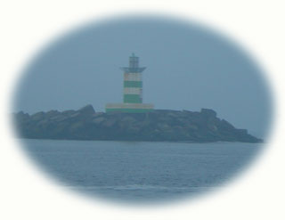 IJmuiden's harbour pierhead through the morning gloom