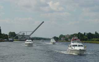 The Broom fleet pass under Pegasus bridge