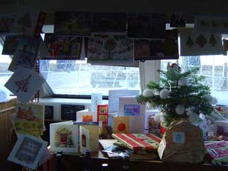 Our baby tree and Christmas cards make a festive display