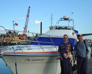 Proud parents of big boat and teeny baby