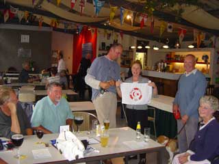 Presenting our club flag to the Flandria yacht club