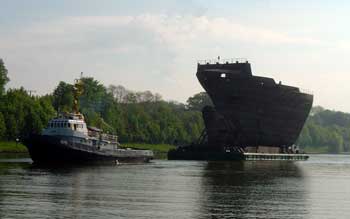 Half a boat on tow on the Kiel canal