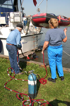 A diver checks out the damage to our port prop
